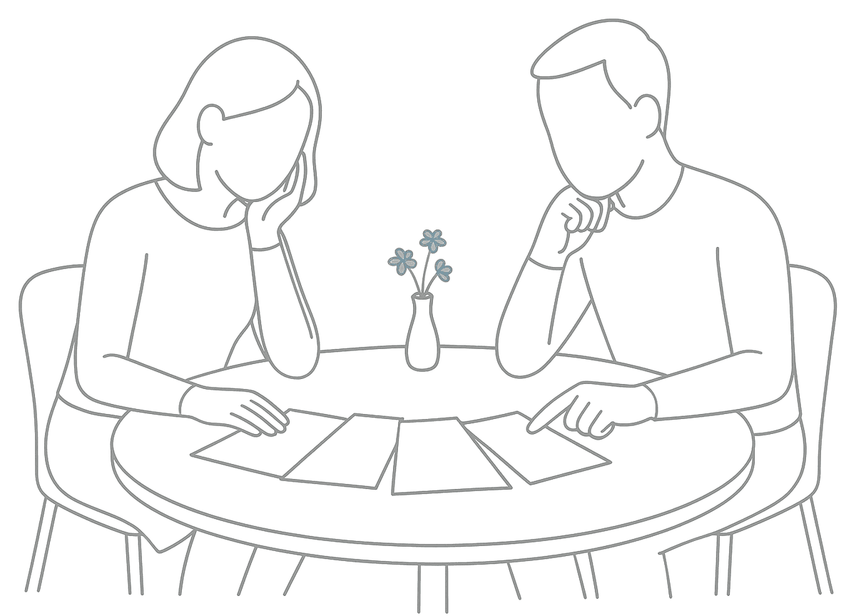 Line drawing of a man and a woman at a small round table weighing up a fan of papers laid out like options, with a vase of blue flowers between them