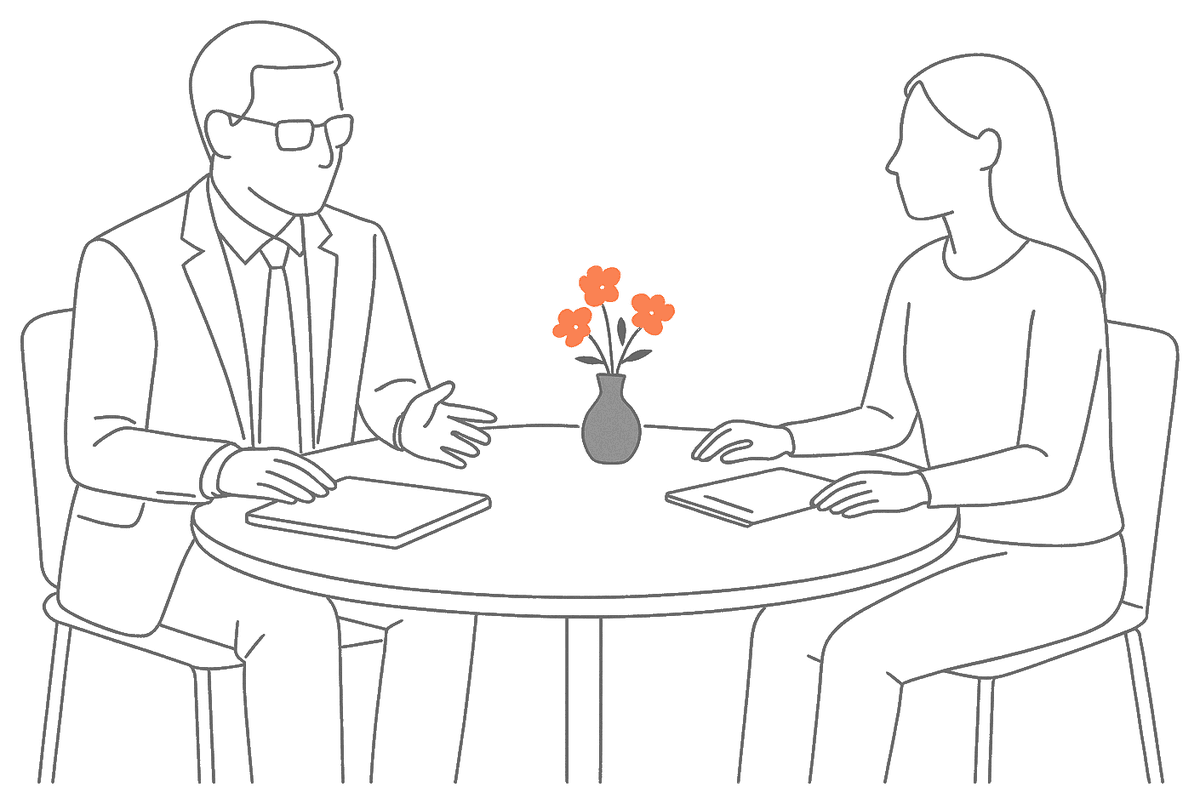 Line drawing of a solicitor and a client talking across a small round table, with a vase of orange flowers between them